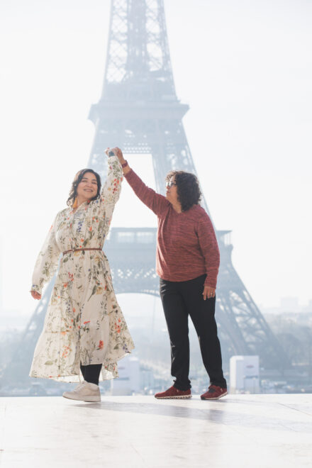 LGBTQ friendly photoshoot - two women dancing in front of the Eiffel Tower