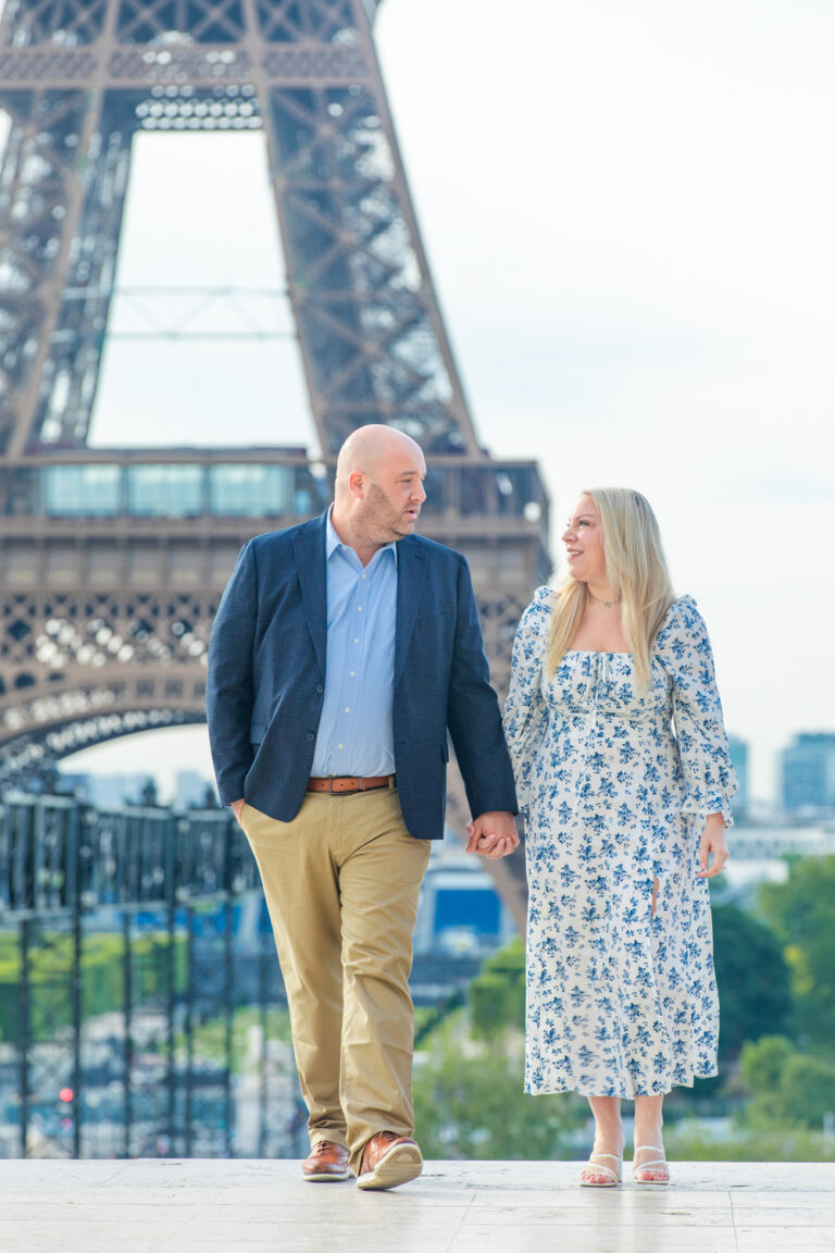 Katie and Dan walking in front of the Eiffel Tower