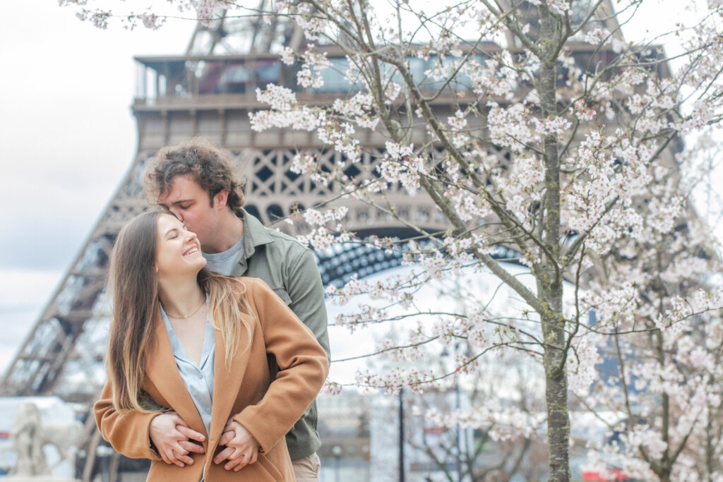 Spring blossom photoshoot with a young couple at the Trocadero Gardens in front of the Eiffel Tower