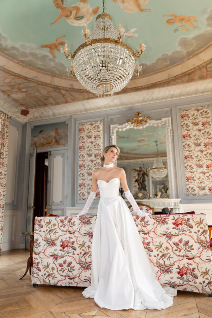 Bride portrait inside Château Sainte Sabine with painted ceilings and elegant French château interiors