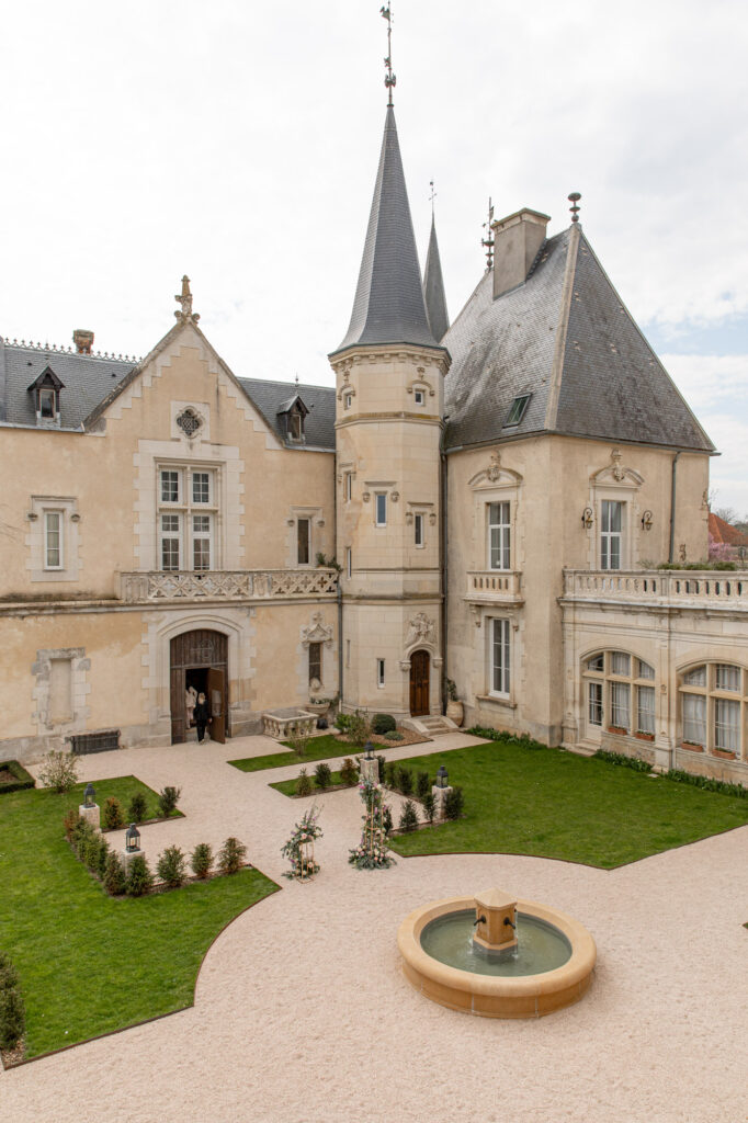 Courtyard and fountain at Château Sainte Sabine, a luxury château wedding venue in Burgundy France